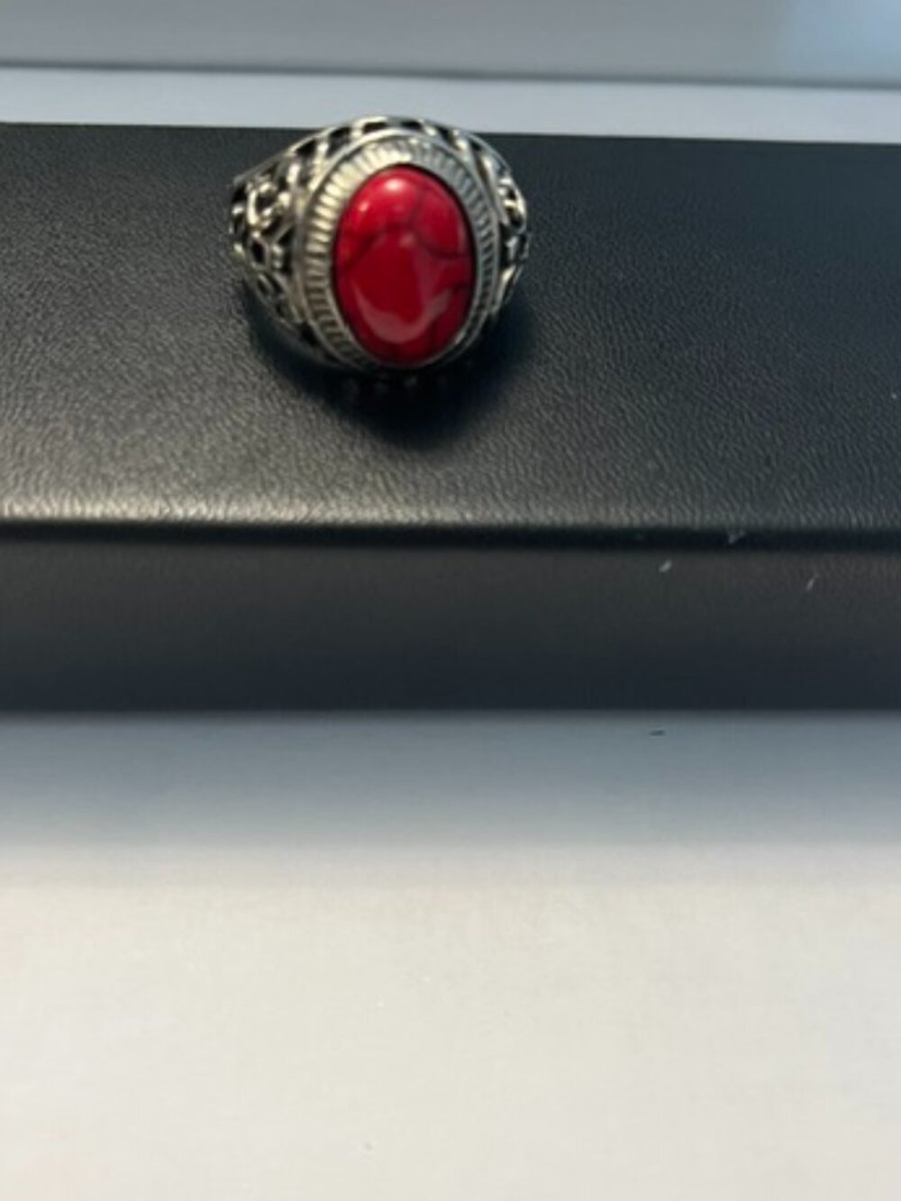 Indian handcrafted silver-tone and coral men’s ring.